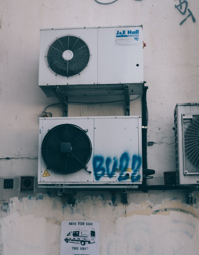 The Art of Drawing Readers In: Your attractive post title goes here Low angle of weathered dirty air conditioner boxes installed on shabby wall of building on street